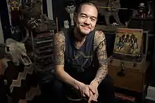 Jesse Tittsworth smiling during a photo shoot