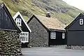 Old wooden houses with turf roof in Tjørnuvík.