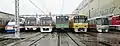 Two 5300 series EMUs at Magome Depot during the 2015 Toei Festival. The trains here are (from left) a Keisei AE100 series, two 5300 series, a Chiba New Town Railway 9000 series, a Keikyu N1000 series and a Toei 12-000 series.