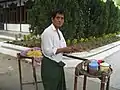 To hpu thouk (Burmese tofu salad) hawker at Kuthodaw Pagoda, Mandalay