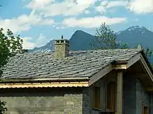 Image 39Alpine chalet being built in Haute-Maurienne (Savoy), the use of thick pieces of orthogneiss (4–7 cm) is by the strict architectural regulations in the region bordering the national parks of Vanoise-Grand Paradis. (from Alps)