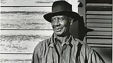 Tom Albert against a doorframe near his home in New Orleans, Louisiana September 25, 1954.