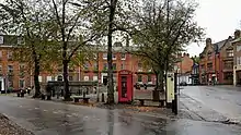 Broad open space with a narrow street running through it