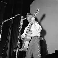 Image 2Tommy Steele, one of the first British rock and rollers, performing in Stockholm in 1957 (from Rock and roll)