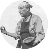 elderly, gloomy looking man in gardening apron