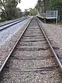 Wooden sleepers on broad gauge track in August 2008