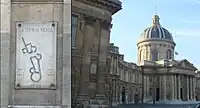 A plaque on the northern wall of the Institut de France shows the ancient location of the Tour de Nesle