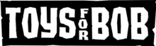 Toys for Bob in all capital letters, against a black background. The word "for" is arranged in a vertical column, between the other two words.