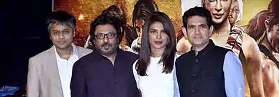 A photograph of Ajit Andhare, Sanjay Leela Bhansali, Priyanka Chopra and Omung Kumar looking forward, smiling and posing for the camera