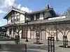A two-story wooden railroad station building