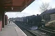 A local train waits to stop at Rugby Central in 1966, shortly before the line was closed as a through route.