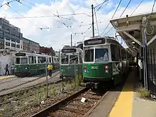 Light rail trains at a surface-level terminal