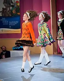 Image 37Irish dancers in Irish dancing costumes, which often feature lace or an embroidered pattern copied from the medieval Irish Book of Kells. (from Culture of Ireland)