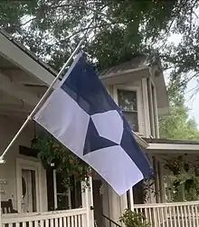 The flag of Antarctica flies outside a house in the USA on Antarctica's Midwinter Day.