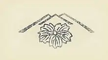 A publisher's seal in the shape of a flower within a stylized mountain