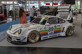 RWB Porsche 964 with a livery paying tribute to a Porsche 935 sponsored by Apple Computer that raced in 1980