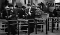 Passengers going through turnstiles on the line c.1934