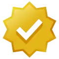 Gold-colored eight-lobed badge with checkmark icon