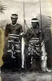 Kanak warriors holding clubs