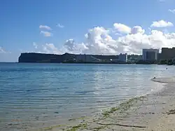 The sihouette of Two Lovers Point dominates the view north from the Tumon tourist center