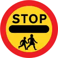 Stop, children crossing ahead (This sign can only be displayed by a person at a patrolled crossing).