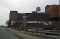 This picture was taken the day the hospital was renamed from "Mercy Hospital of Pittsburgh" to "UPMC Mercy". The hospital helipad is visible to the right, and the entrance to Duquesne University is visible to the far left. The MacLachlan Wing, an 8 floor high-rise is on the right.