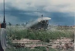 U.S. Army armored personnel carrier (APC) spraying Agent Orange over Vietnamese rice fields during the Vietnam War.