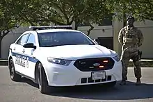 A Ford Police Interceptor Sedan, typically employed by the USAF Security Forces.