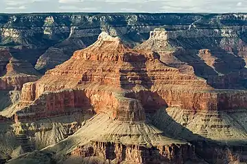 Wescogame Formation slopes directly below upper-vertical-cliff of Esplanade Sandstone-(below Hermit Formation and white Coconino Sandstone prominence).Isis Temple, with complete Supai Group for Grand Canyon; (Pakoon Limestone miles westward in Grand Canyon, and Nevada)