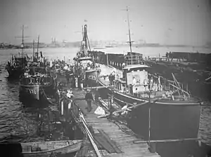 USS Absegami (SP-371) is at left center in this photograph of United States Navy patrol vessels at Philadelphia, Pennsylvania, on 15 January 1919. Astern of Absegami is a section patrol boat identified only as SP-1595 (left background). Across the pier are the submarine chaser USS SC-23 (right background), and an unidentified submarine chaser (right foreground).