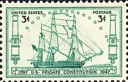 A postage stamp accurately depicts Constitution at sail. The ship sails to the right side of the stamp.