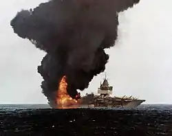 USS Enterprise (CVN-65) burning, stern view