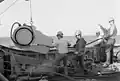 USS Illusive  lowers a different acoustical device for training.
