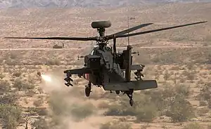 An AH-64D attack helicopter conducts AGM-179 air-to-surface missile live-fire test on Cibola Range at YTC.