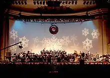 The United States Navy Band Concert Band performs traditional and popular holiday music for the television special, "Happy Holidays" at DAR Constitution Hall in Washington, D.C., 2001.