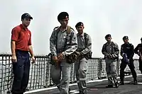 US Coast Guard directs Royal Brunei Navy personnel aboard USS Crommelin (FFG-37) during CARAT 2009.
