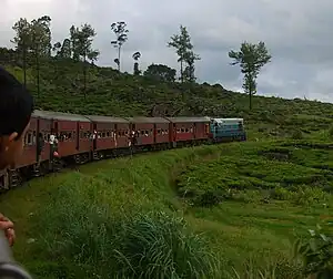 An express train, the Udarata Menike, runs through the scenic Sri Lankan hill country