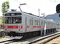 1000 series set 1001 in May 2012.  Front designation/service signs shown are from former Tokyu Toyoko line service with through-running to the Tokyo Metro Hibiya Line.