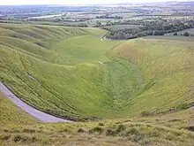 View from the White Horse, looking towards the burial ground by the wind turbines of Westmill Wind Farm in the distance