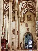 Northern aisle, divided in two by an additional arcade. The base of one arch covers an imperial eagle painted before modification of the vaulting.