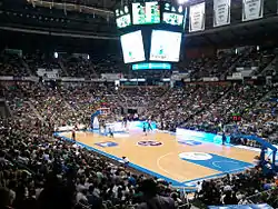 An indoor arena filled with people.