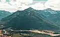 Aerial view of Union centered, with parent Capitol Mountain to right, and Middle Fork Flathead River at bottom of feame.