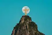 Christ the Redeemer with the Moon in the background.