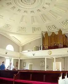 Contemporary view of the interior and its decorative plaster domed ceiling