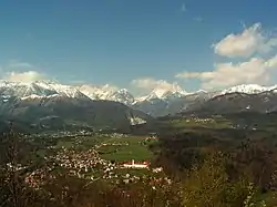 A portion of the Kamnik–Savinja Alps with the northern suburbs of Kamnik in the foreground