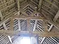 Roof truss in hay barn-reused from an earlier building