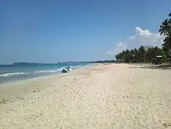 Uppuveli Beach in Trincomalee city, a coastal resort city, with Konesar Malai in background