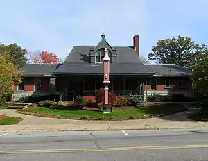 A brick railway station in Queen Anne style