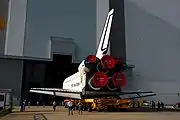 Endeavour on its way into the VAB during the launch preparations for STS-89. At the top of the doorway is the slot for the vertical stabilizer.