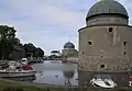 Circular turrets by the moat.